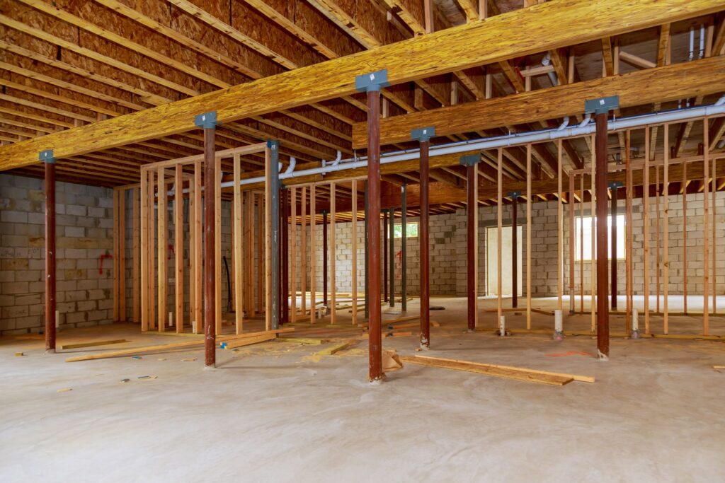 Basement renovation planning with insulation, drywall and vinyl plank flooring in an Edmonton home